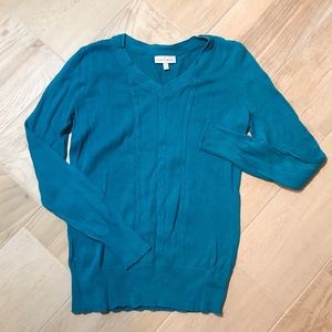 Bright blue cable knit V-neck sweater